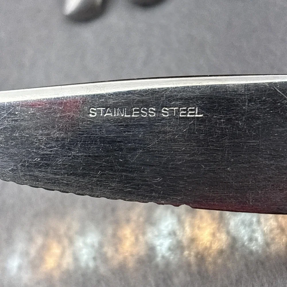 SSI Stainless Japan Black Canoe Style Resin Handle Serrated Edge Dinner Knife 6‎